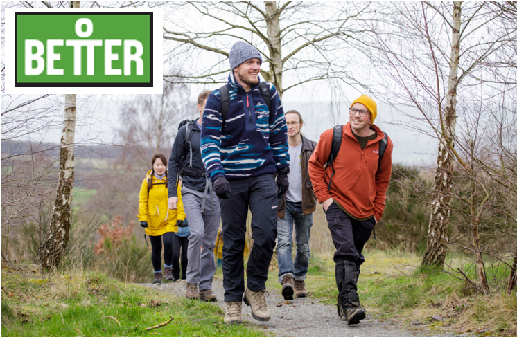 a group of people outside in nature on a wellbeing walk, 